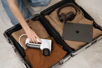 a person put something on travel case