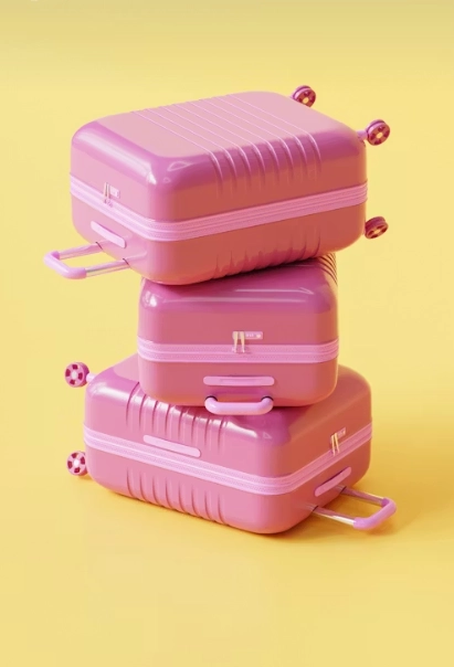 three pink luggages