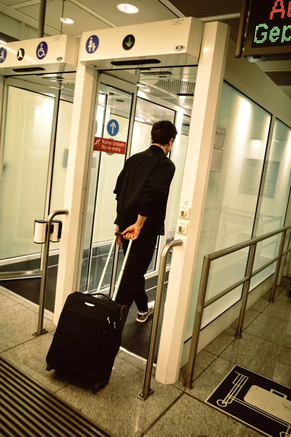 passenger with rolling suitcase